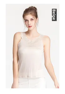 Close-up of elegant V-neck lace trim and silky beige mulberry silk camisole top