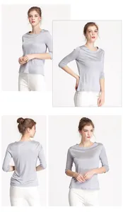 Detail view of women's grey mulberry silk top with boat neck and three-quarter sleeves