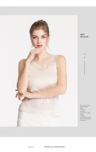 Detailed close-up of silk camisole featuring delicate lace trim on the V-neckline
