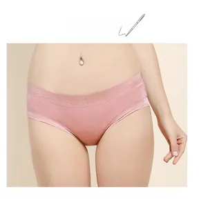 Detailed close-up of pink silk seamless panties with elegant floral lace waistband