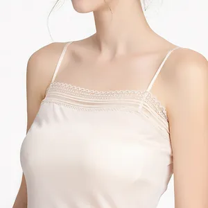 Elegant silk knitted camisole for women with lace trim in champagne color, front view