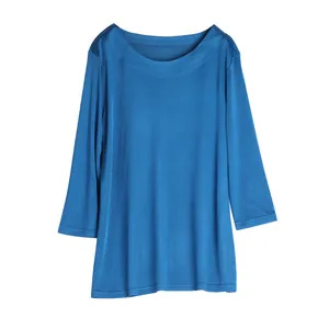 Elegant peacock blue silk blend top with three-quarter sleeves and wide round neckline