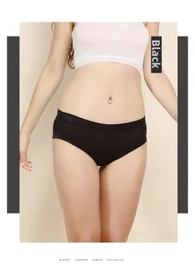 Detail view of seamless silk panties with laser-cut lace trim and breathable black fabric