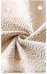 Macro shot of light beige chenille fabric showing soft anti-scratch woven texture