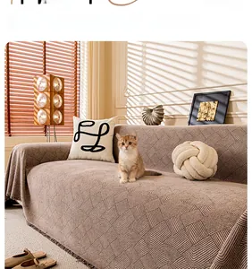 Close-up of chenille sofa cover with textured linear patterns and decorative fringe trim