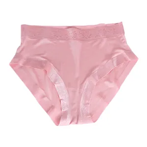 Women's silk seamless panties with soft pink fabric and delicate floral lace edges