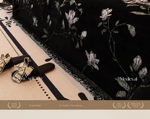 Detail of vintage floral sofa cover with fringe edge and retro black magnolia pattern