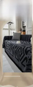 Detailed texture of bohemian geometric patterns on dark grey soft cotton velvet sofa cover