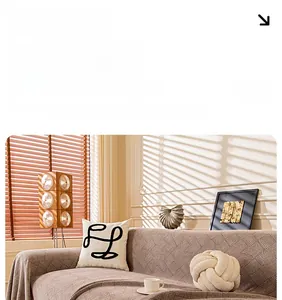 Close-up of waterproof chenille sofa cover featuring retro wave texture and warm beige tones