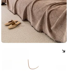 Detail of waterproof chenille sofa cover with vintage wavy patterns and fine tassels