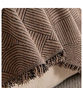 Detail of chenille fabric showing vintage geometric patterns and fine fringe textures