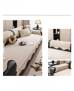 Detail of beige quilted sofa cover with lily pattern and decorative fringe tassels