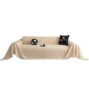 Vintage chenille sofa cover in beige with wavy knit texture and tassel edges