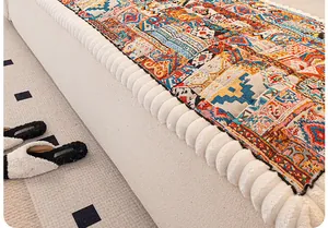 Close-up of thick bohemian geometric pattern sofa cushion with rich ethnic woven textures