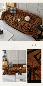 Detail of bohemian chocolate brown fleece sofa cover featuring geometric patterns and textures