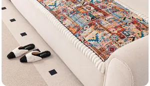Detail of bohemian colorful patchwork sofa cushion with geometric and floral patterns