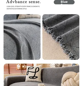 Detail of blue-gray chenille sofa cover showing geometric ripples and fringed edges