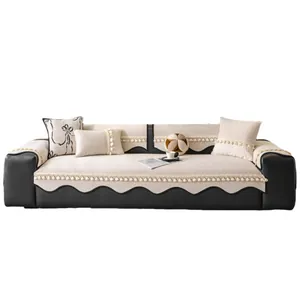 Luxurious cream chenille sofa cover set with black wavy edges and fringed tassels