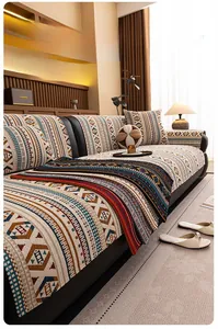 Detail of bohemian chenille sofa cover showing thick geometric pattern and texture