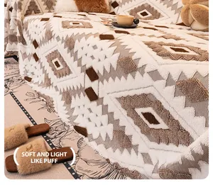 Detail of bohemian geometric tufted blanket with tassels showing soft plush fabric texture