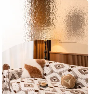 Detail of geometric ethnic pattern on thick plush sofa throw with cozy textured pillows