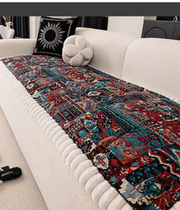 Close-up of bohemian jacquard sofa cover with colorful geometric patterns and thick white borders