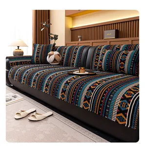 Detailed texture of bohemian chenille sofa cover with woven geometric tribal patterns