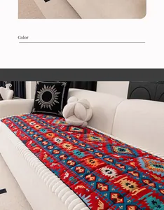 Detail of red Bohemian style quilted sofa cover with ethnic tribal geometric patterns