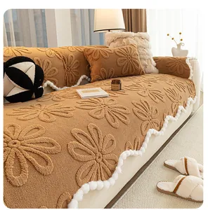 Detailed view of camel plush sofa cover featuring 3D daisy pattern and white pom-pom trim