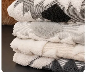 Close-up of thick plush sofa blanket with black and white star pattern and high color fastness