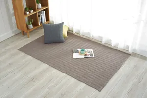 Detail of soft brown quilted cotton floor mat with non-slip silicone backing and diamond pattern