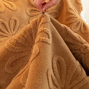 Thick sunflower embossed plush sofa cover in camel fleece with non-slip texture