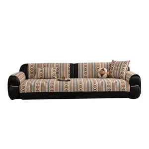 Bohemian chenille sofa cover with geometric patterns and matching decorative pillows