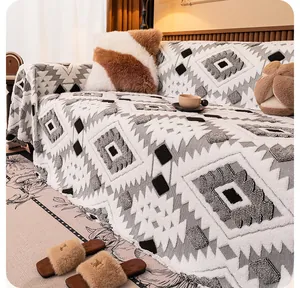 Detail of plush sofa blanket with textured 3D geometric patterns and warm fleece fabric