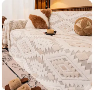 Close-up of plush off-white sofa throw blanket with embossed geometric diamond texture