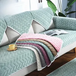 Detail of Nordic leaf pattern quilted chair cushion with decorative wavy lace border