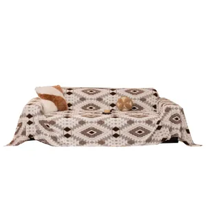 Thick plush winter sofa blanket with bohemian geometric diamond patterns on white fabric