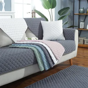 Detailed view of quilted faux rabbit fur sofa cover with elegant diamond stitch patterns
