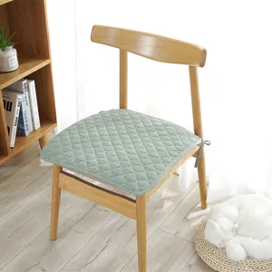 Nordic minimalist quilted light green chair pad with non-slip ties on wooden seat