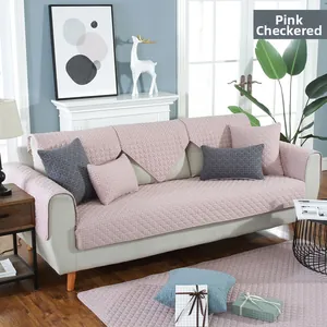 Detail of pink checkered quilted chair cushion with non-slip texture for office home