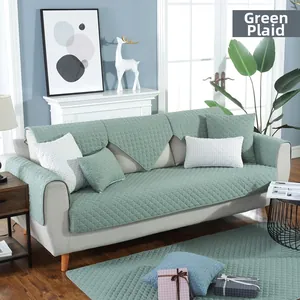Detail of green checkered quilted cotton chair cushion set with matching pillow