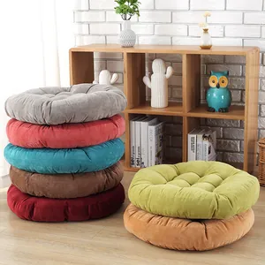 Close-up of colorful corduroy cushions showing nine-hole quilting and textured fabric