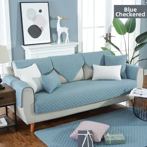 Detail of blue plaid quilted seat cushion with non-slip texture and ties for dining chair