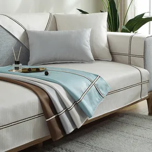 Detail of Nordic herringbone weave plush sofa cover with woven decorative borders