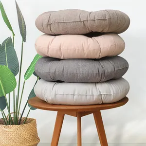 Stack of four Japanese cotton linen cushions in brown, pink, and grey for home decor