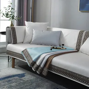 Detail of plush anti-slip sofa cover with Nordic style leaf pattern and thick faux fur texture