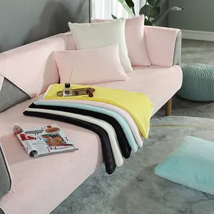 Close-up of plush faux rabbit fur sofa covers in multiple warm colors for home decor