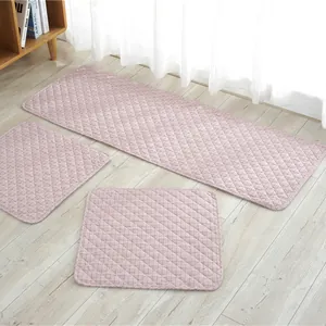 Close-up of pink quilted chair cushions with non-slip ties and soft cotton texture