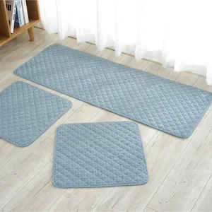 Detailed view of the grey-blue quilted diamond pattern on the cotton seat cushion set