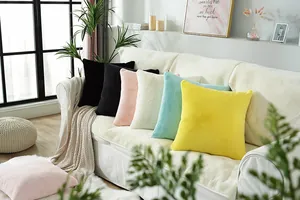 Close-up of colorful faux rabbit fur square decorative cushions with soft plush texture